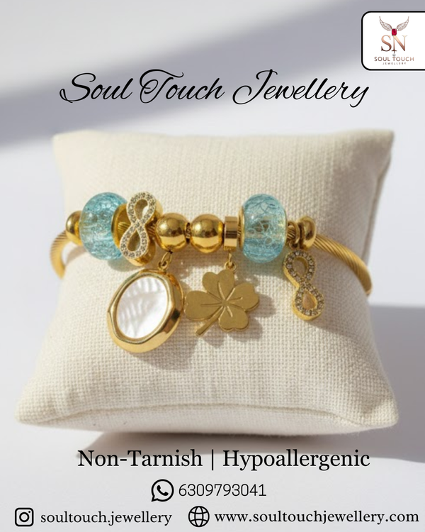 Infinity Luck Charm Bracelet – Gold-Tone Symbolic Charms & Pastel Beads