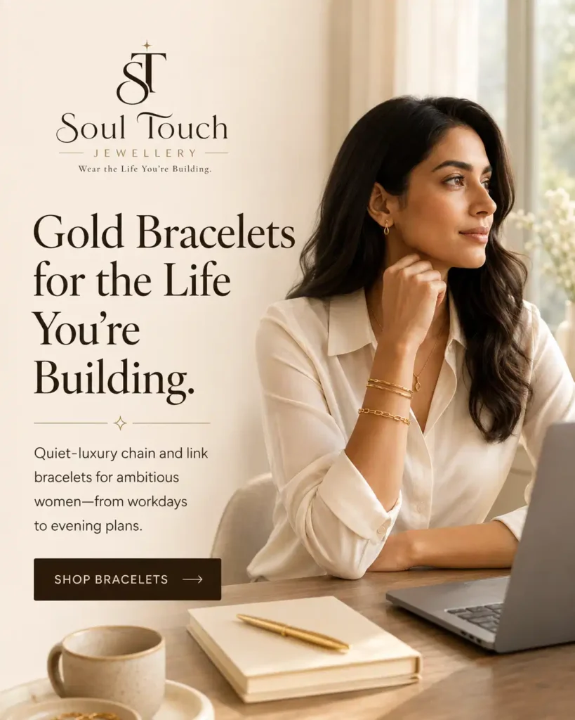 Modern Indian working woman wearing gold chain and link bracelets by Soul Touch Jewellery at her desk.