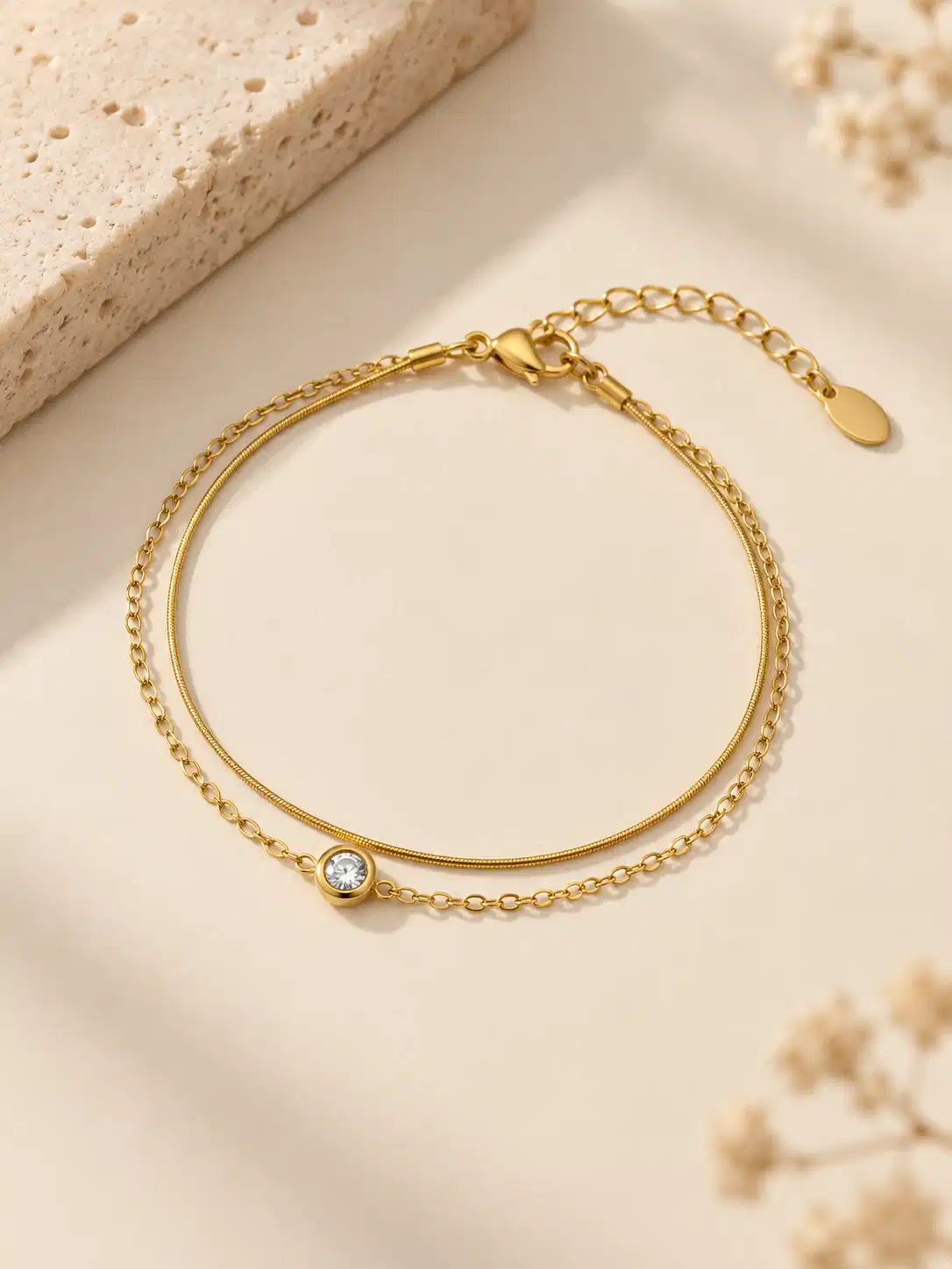 Alira double chain gold bracelet with single clear stone for women