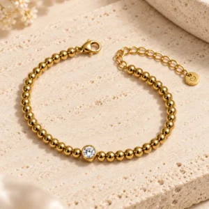 Aurelle gold beaded bracelet with centre stone and adjustable clasp