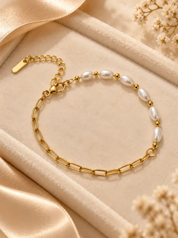 Aurelle gold pearl link bracelet with white oval beads and paperclip chain