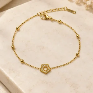Calista hexagon gold chain bracelet with clear stone halo and bead accents