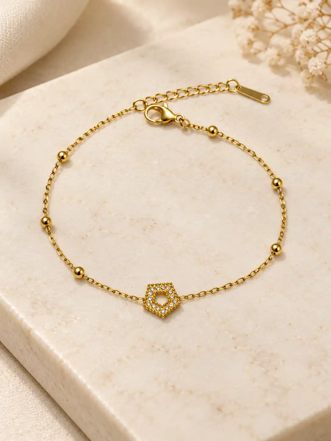 Calista hexagon gold chain bracelet with clear stone halo and bead accents