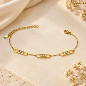 Evara geometric gold chain bracelet with three clear stone frame motifs