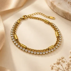 Serena double strand gold tennis bracelet with clear stones and chain detail